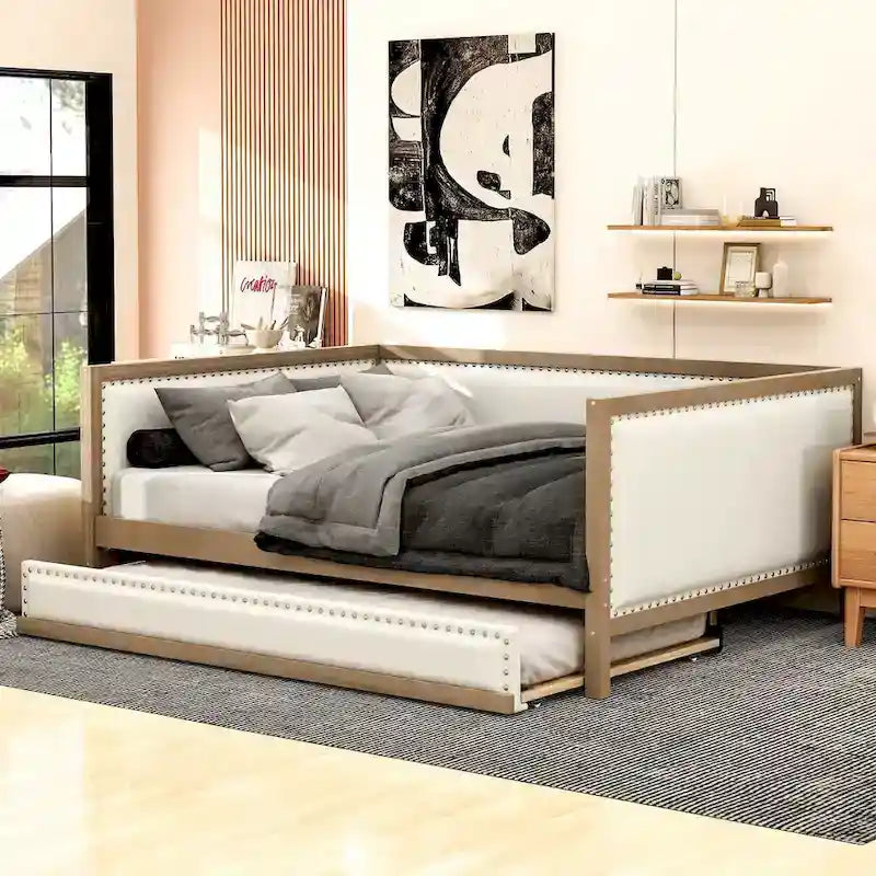 Letto a una piazza e mezza imbottito con letto estraibile e decorazione con borchie