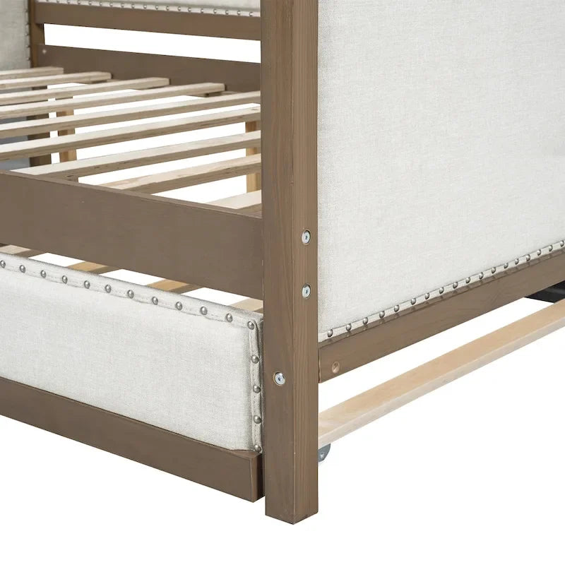 Letto a una piazza e mezza imbottito con letto estraibile e decorazione con borchie